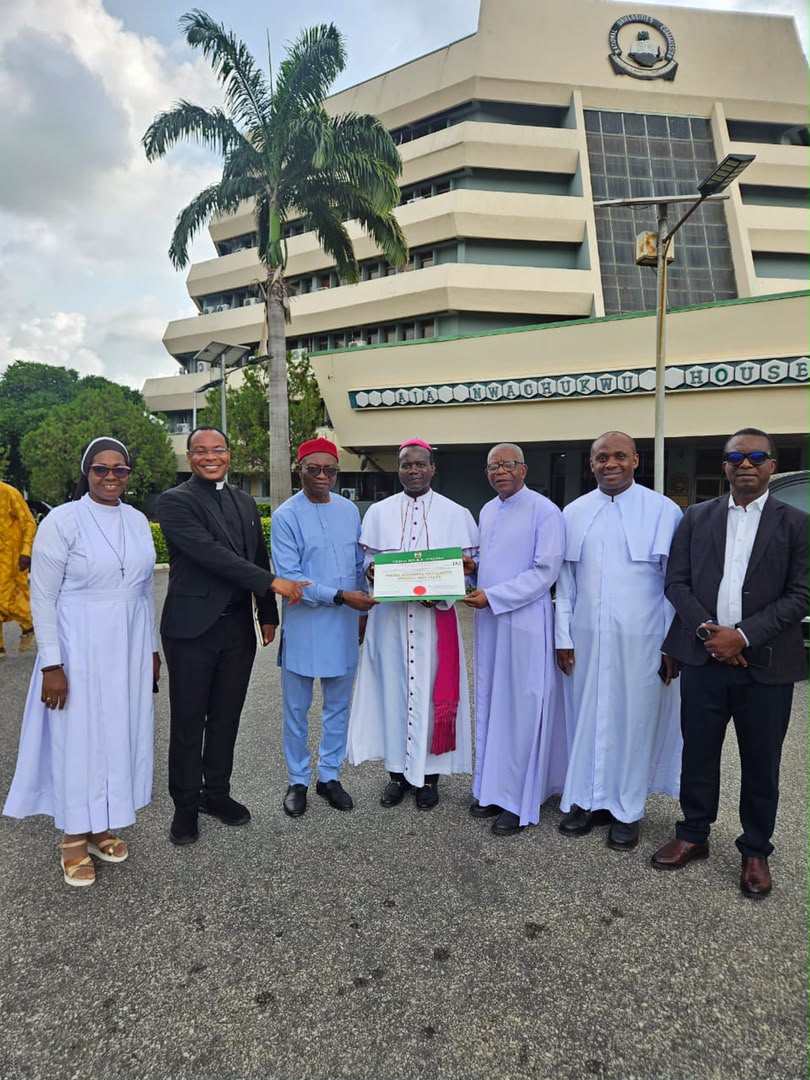 Church leaders and university representatives presenting the licence for Maria Assumpta University, Owerri